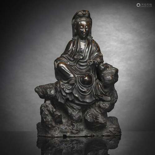 A BRONZE FIGURE OF GUANYIN