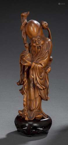 A FINE CARVED BOOXWOOD FIGURE OF STANDING SHOULAO AND WOOD S...