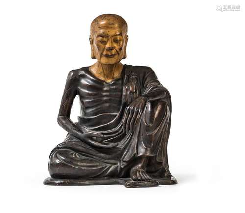 A PART-GILT BRONZE FIGURE OF A SEATED LUOHAN