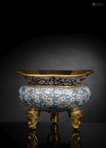 A PART-GILT CLOISONNÉ VESSEL WITH FLOWER DECORATION RESTING ...