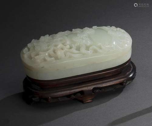 AN OVAL CARVED JADE BOX AND COVER WITH GOUTD AND FLOWER RELI...