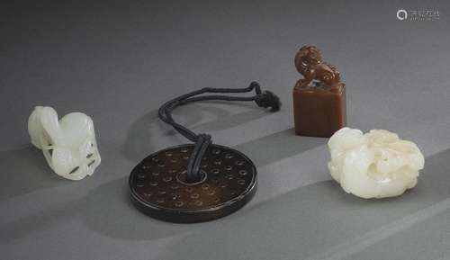 A GROUP OF FOUR JADE CARVINGS AND A SOAPSTONE SEAL