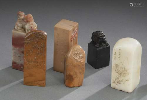 A GROUP OF SIX CARVED SOAPSTONE OR STONE SEALS OR WEIGHT