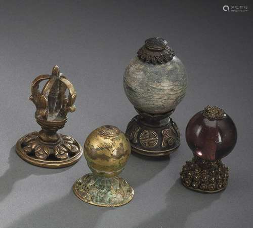 A GROUP OF FOUR MANDARIN HEAD FINIALS