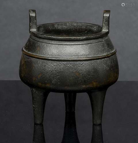 A BRONZE TRIPOD CENSER