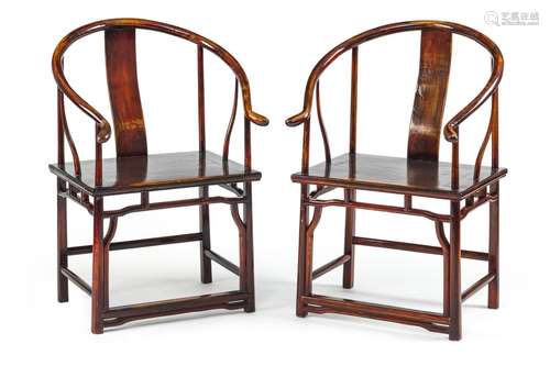 A PAIR OF WOODEN HORSESHOE CHAIRS