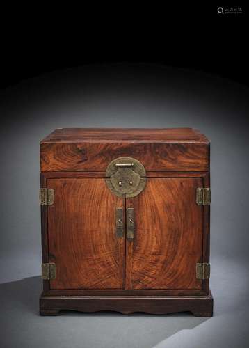 A FINE HUANGHUALI CABINET WITH TWO DOORS AND DRAWERS