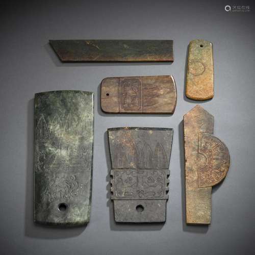 A GROUP OF SIX CARVED JADE AXES OR BLADES IN ARCHAIC STYLE