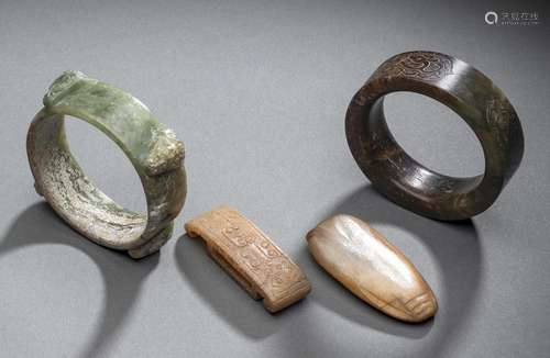 TWO CARVED JADE BANGLES, A SWORD SLIDE AND A CICADA PENDANT