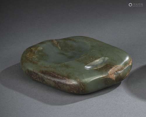 A CARVED JADE PEBBLE INKSTONE