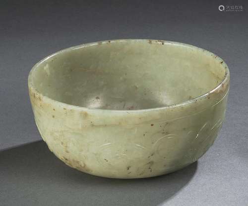 A CARVED CHILONG AND LINGZHI LIGHT GREEN JADE BOWL