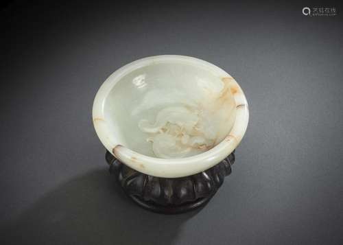 A FINELY CARVED LIGHT GREEN JADE BRUSHWASHER WITH A PAIR OF ...