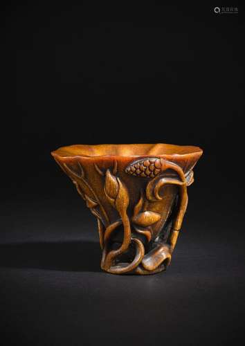 A FINE AND RARE RHINOCEROS WINE CUP WITH LOTUS