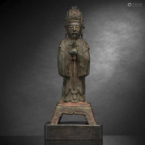 A BRONZE FIGURE OF TIANGUAN STANDING ON A FOUR-FOOTED PEDEST...