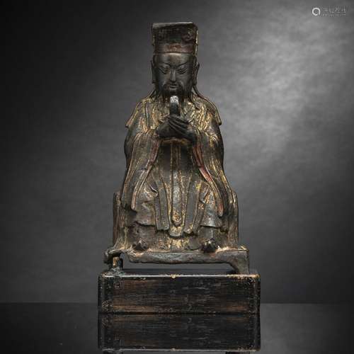 A BRONZE FIGURE OF TIANGUAN WITH RESIDUE OF GILDING AND RED ...