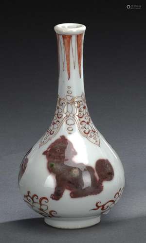 A COPPER-RED THREE ANIMALS BOTTLE VASE WITH ADDITIONAL DECOR...