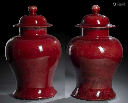 A PAIR OF COPPER-RED GLAZED PORCELAIN VASES AND COVERS