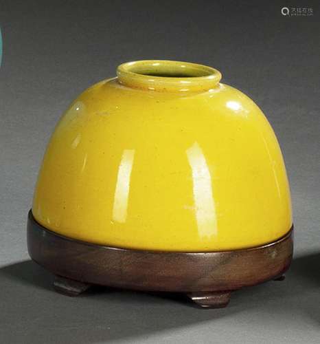 A YELLOW-GLAZED BISCUIT PORCELAIN BRUSHWASHER ON A WOOD STAN...