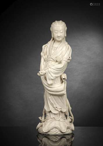 A RARE CREAM-GLAZED TONGQI WARE FIGURE OF STANDING GUANYIN