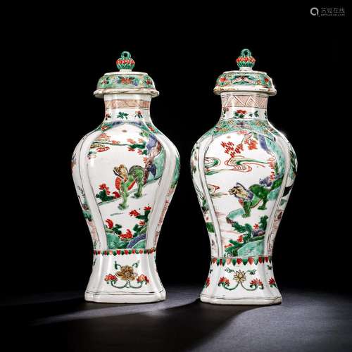 A PAIR OF FAMILLE VERTE PORCELAIN VASES AND COVERS