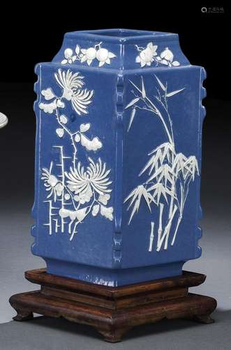 A BLUE-GLAZED LOZENGE-SHAPED MOLDED PORCELAIN VASE WITH DIFF...