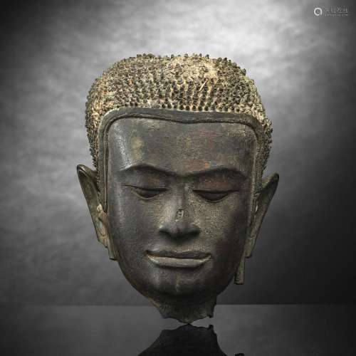 A BRONZE HEAD OF BUDDHA SHAKYAMUNI
