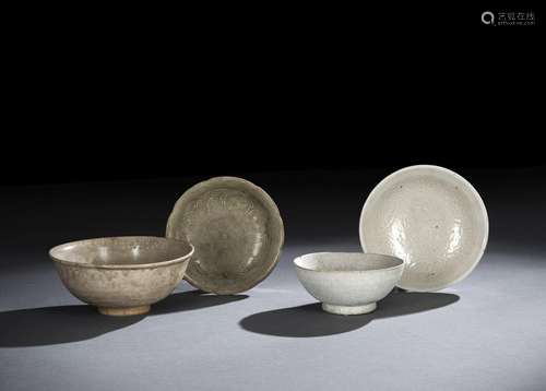 A GROUP OF FOUR SELADON GLAZED BOWLS, PARTLY MOLDED