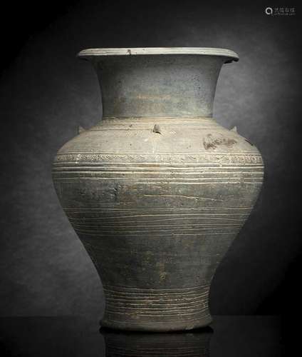 A LARGE GREY POTTERY VASE WITH FOUR HANDLES