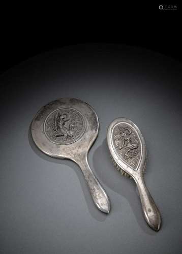 A SILVER HAND MIRROR AND A SILVER HAIR BRUSH WITH FIGURE AND...