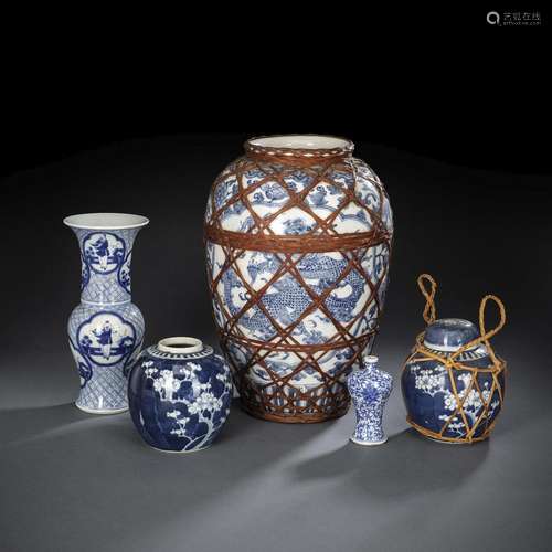 A GROUP OF FIVE BLUE AND WHITE VASES, ONE WITH COVER AND TWO...