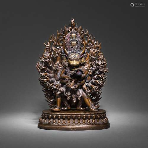 A PARCEL-GILT BRONZE FIGURE OF VAJRABHAIRAVA IN FRONT OF A F...