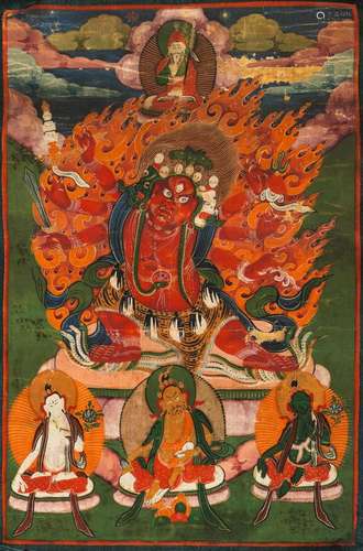 A THANGKA OF MAHAKALA WITH SILK MOUNTING