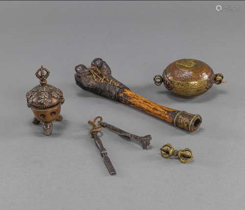 A GROUP OF RITUAL IMPLEMENTS: A BRONZE KAPALA, AN AMULETT, A...