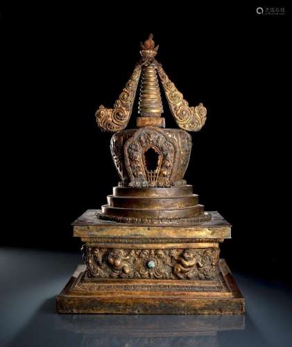 A LARGE GILT-COPPER EMBOSSED STUPA