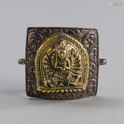 A PARCEL GILT-SILVER DURGA RELIEF BELT-BUCKLE