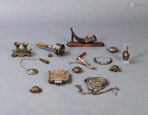 A GROUP OF RITUAL OBJECTS, E.G. A PRAYER WHEEL, GAU, POWDER ...