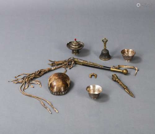 A GROUP OF RITUAL OBJECTS, E.G. CUP STAND, PHURBU, GHANTA