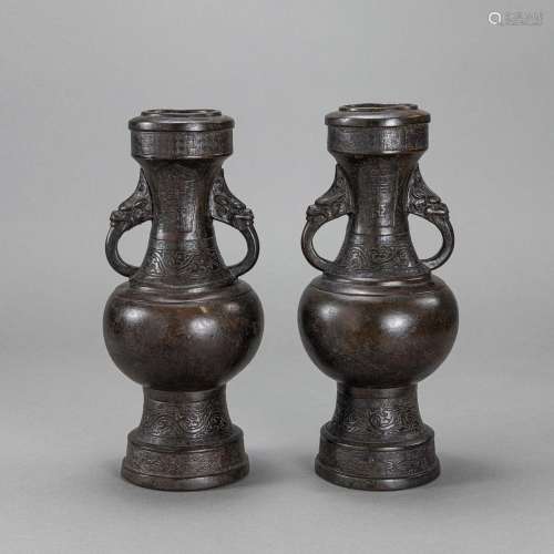 A PAIR OF ARCHAISTIC HANDLED BRONZE VASES
