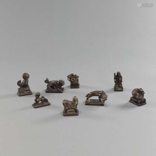 A GROUP OF EIGHT SEALS AND BRONZE WEIGHTS, PARTLY WITH ANIMA...