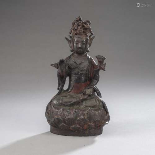 A BRONZE FIGURE OF GUANYIN ON A LOTUS BASE