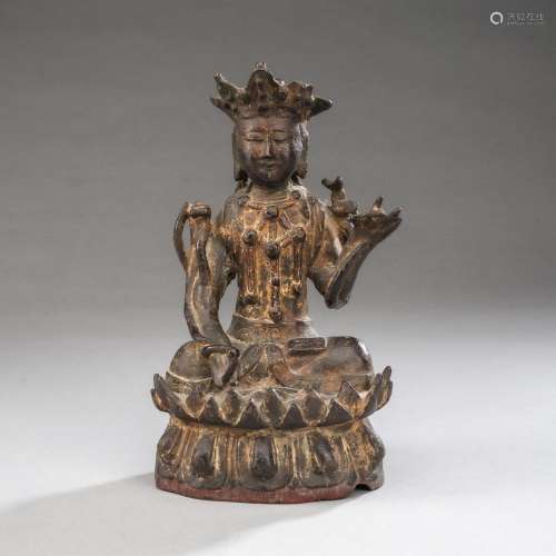 A BRONZE FIGURE OF GUANYIN ON A LOTUS