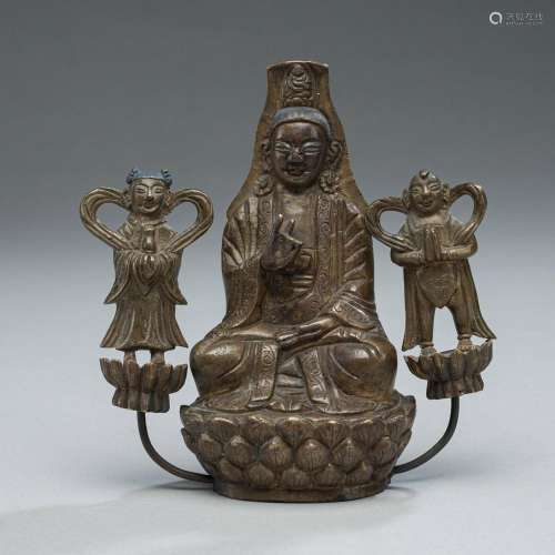BRONZE OF THE SEATED GUANYIN WITH ADORANTS SHANCAI AND LONGN...