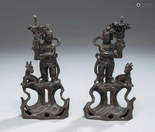 PAIR OF BRONZE CANDLESTICKS IN THE SHAPE OF BOYS (POSSIBLY N...