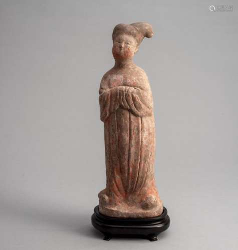 A PAINTED POTTERY STANDING FIGURE OF A FAT LADY