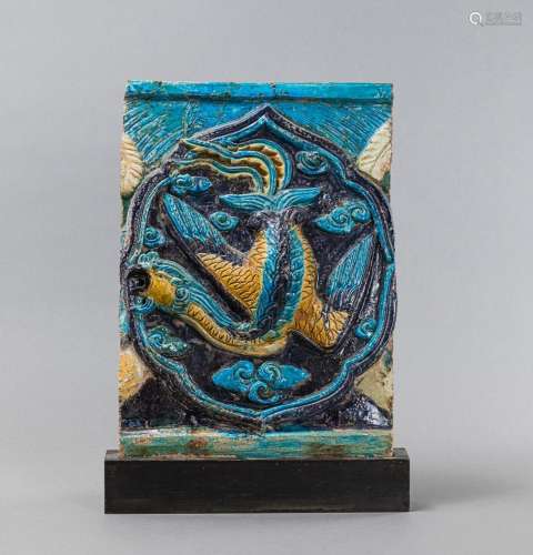 A MOLDED 'FAHUA' TILE WITH PHOENIX AND CLOUDS