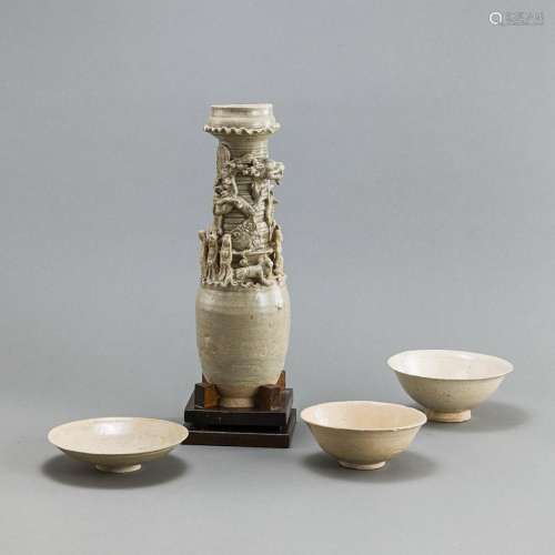 A CERAMIC FUNERARY URN AND THREE BOWLS