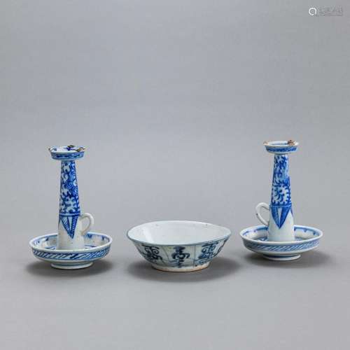 A PAIR OF BLUE AND WHITE PORCELAIN CANDLESTICKS AND A BOWL