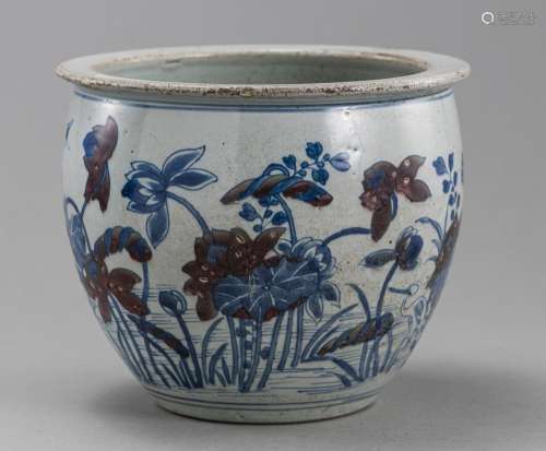 CACHEPOT DEPICTING A LOTUS POND IN UNDERGLAZE BLUE AND PARTL...