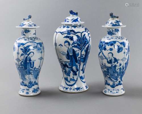 THREE BLUE AND WHITE FIGURAL PORCELAIN VASES AND COVERS