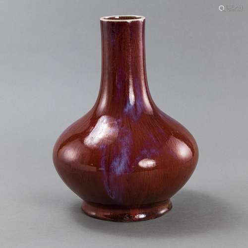 AN OXBLOOD-GLAZED AND FLAMBÉ-STREAKED BOTTLE VASE